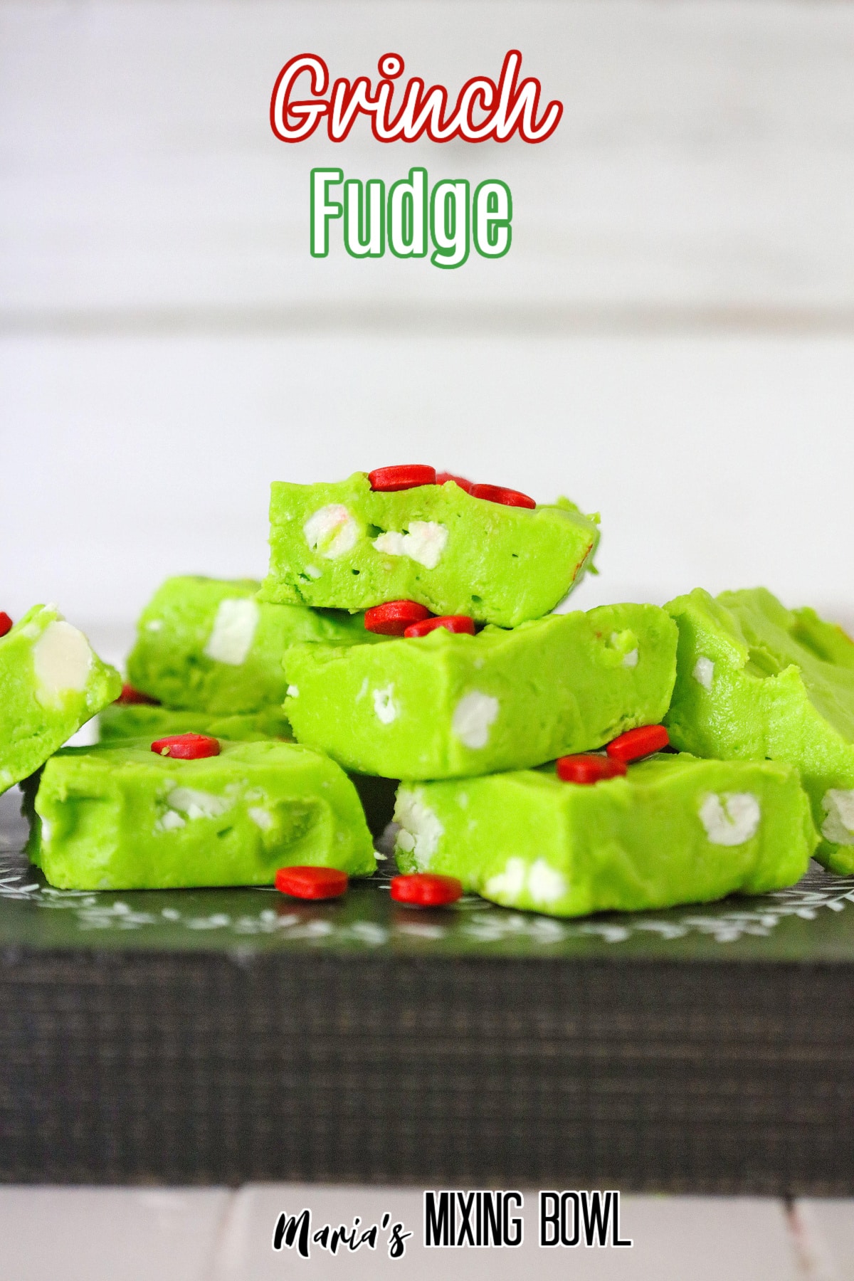 grinch fudge stacked in a pyramid on a wooden background