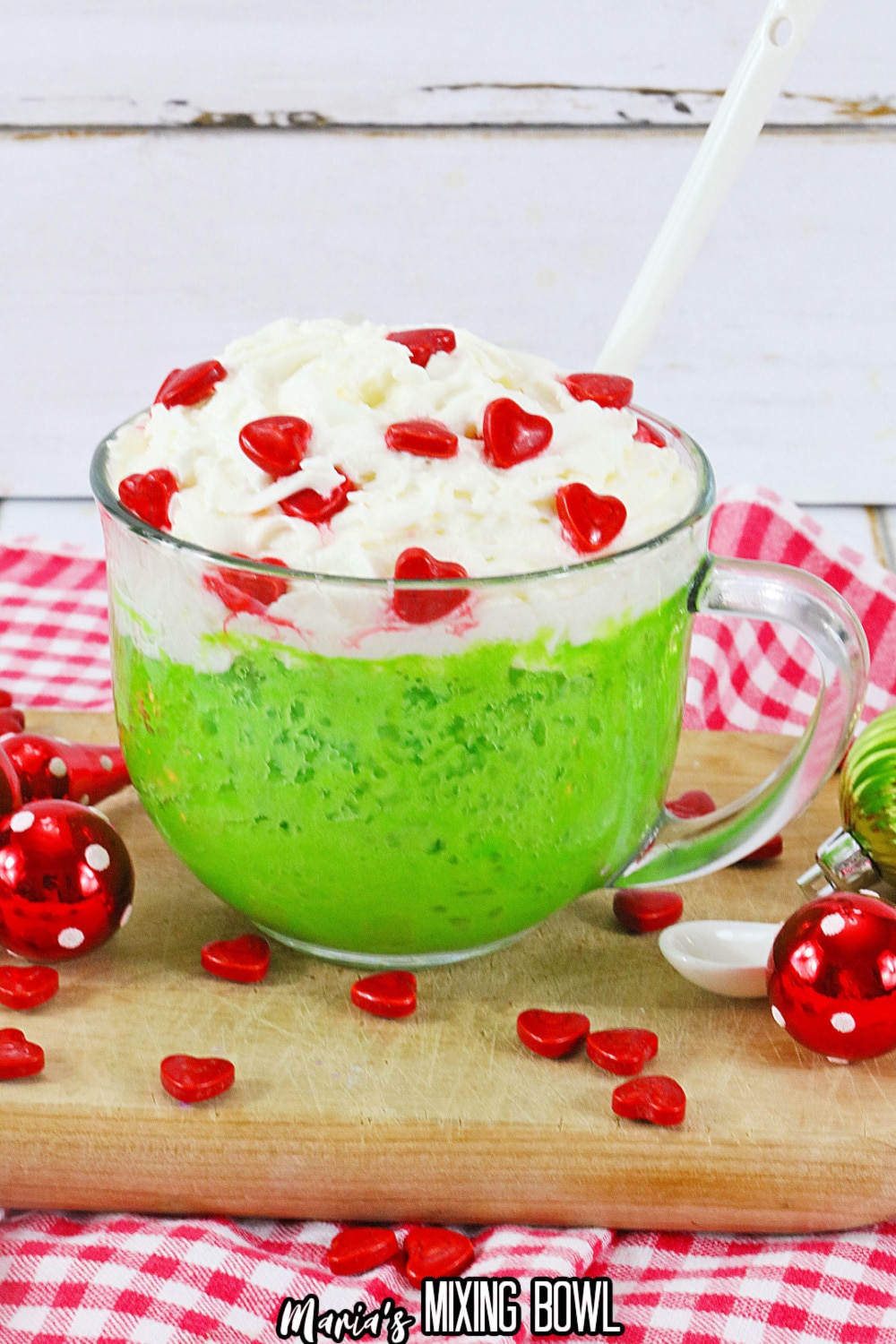 grinch mug cake on a wooden cutting board