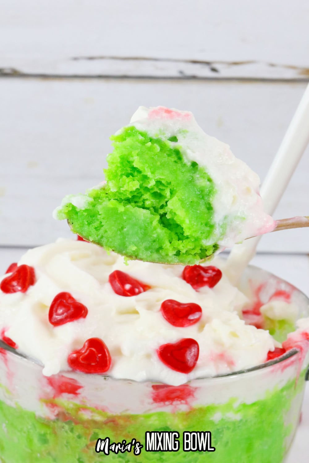spoonful of grinch mug cake held in the air