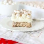 slice of hot cocoa cheesecake bar on a white plate