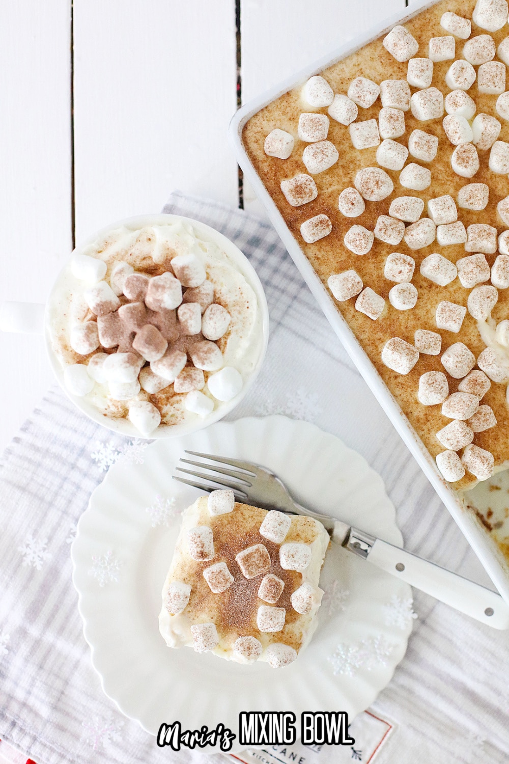 slice of hot cocoa cheesecake bar on a white plate