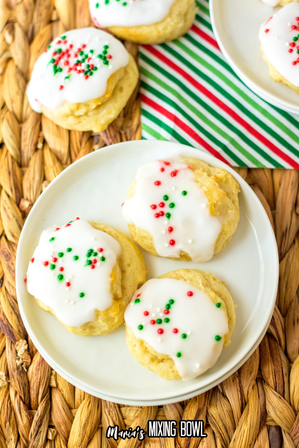 close up of a white plate with three italian christmas cookies
