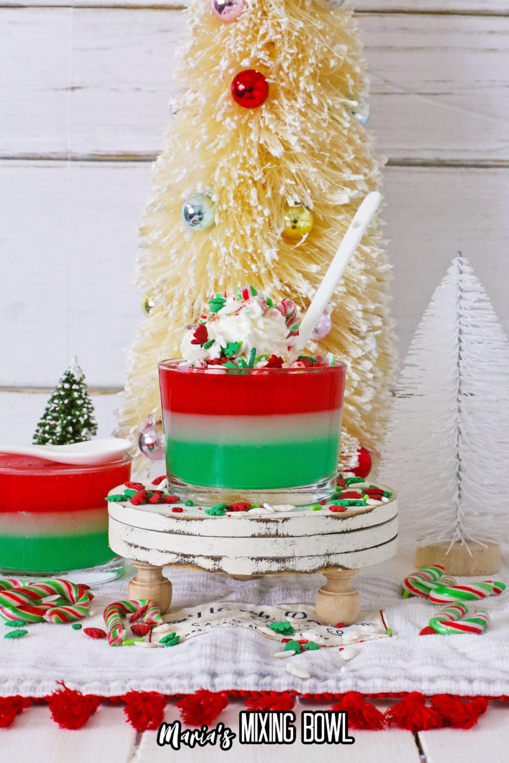 glass of christmas gelatin on a cupcake stand