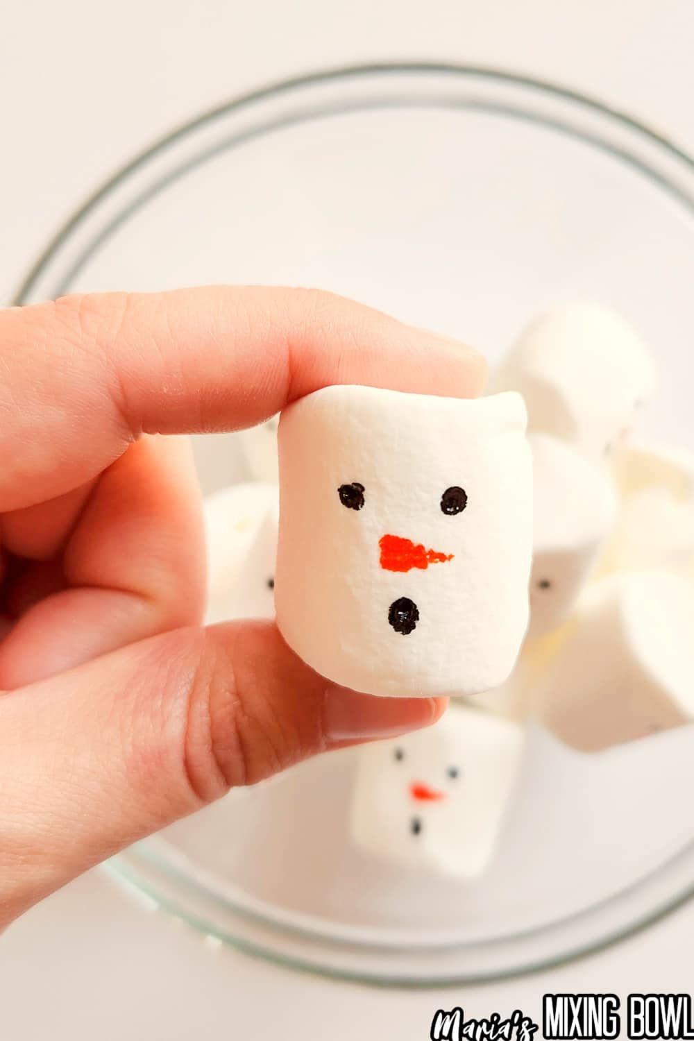 marshmallow with a face drawn on it