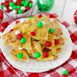 m&m christmas brittle stacked on a white plate