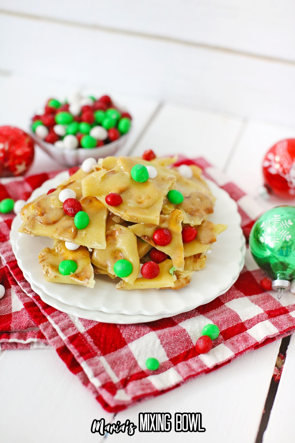 m&m christmas brittle stacked on a white plate