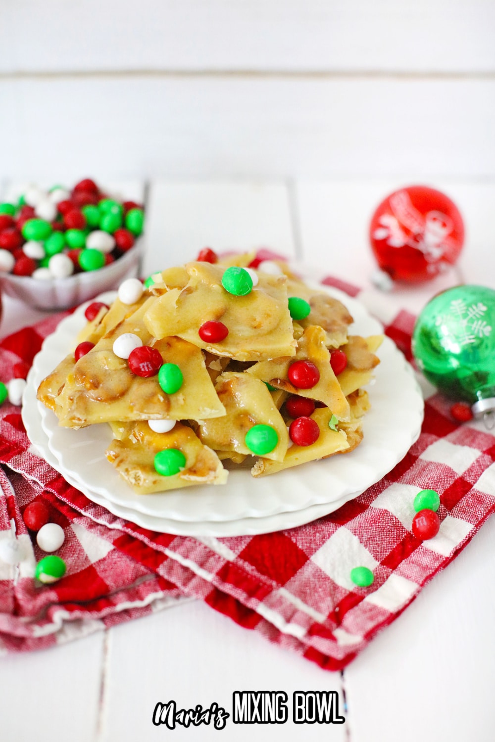 m&m christmas brittle stacked on a white plate