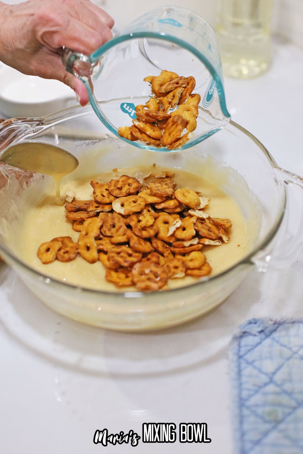 pretzels being added to the cooked candy