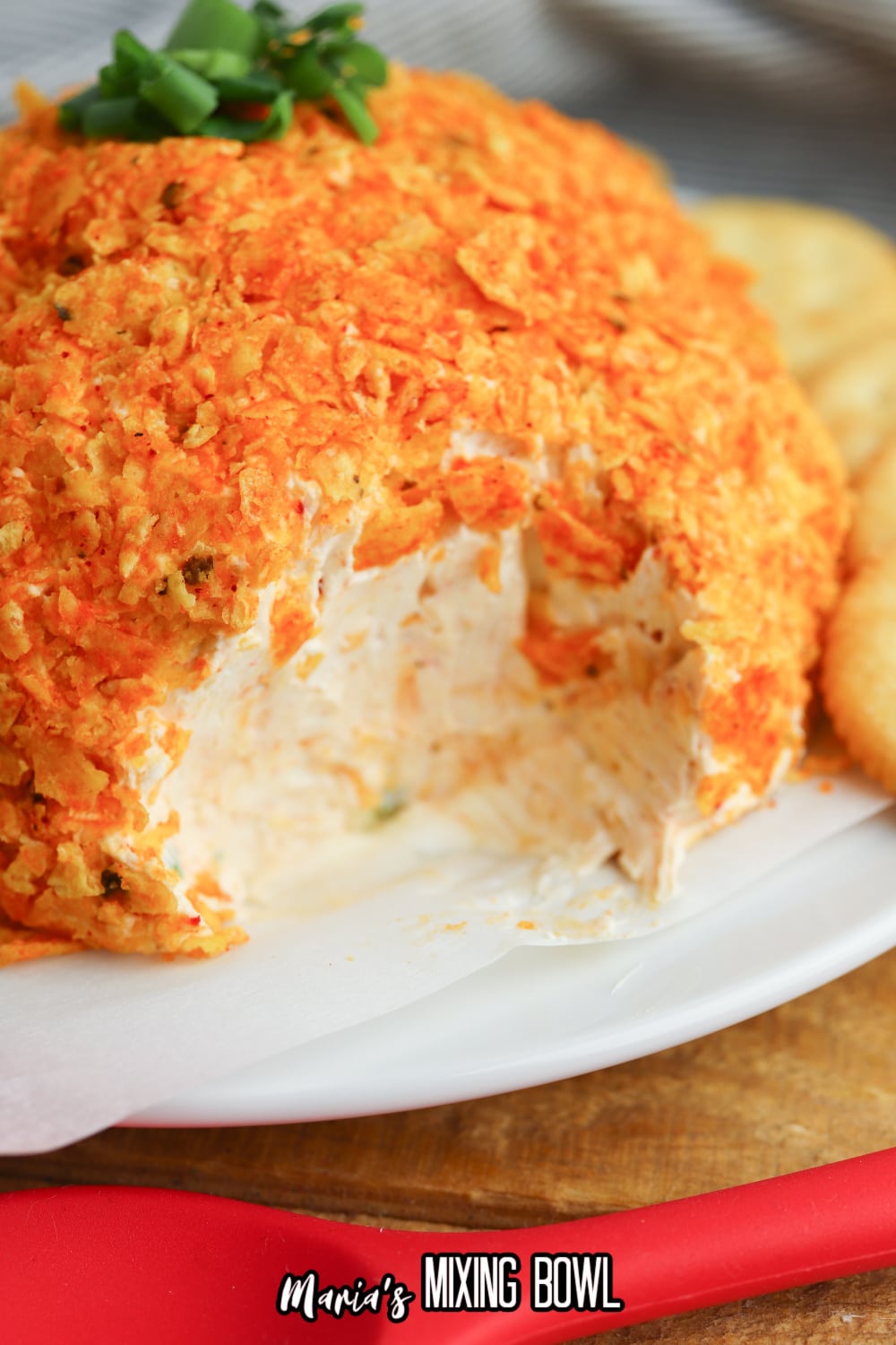 nacho cheese ball with a slice misisng