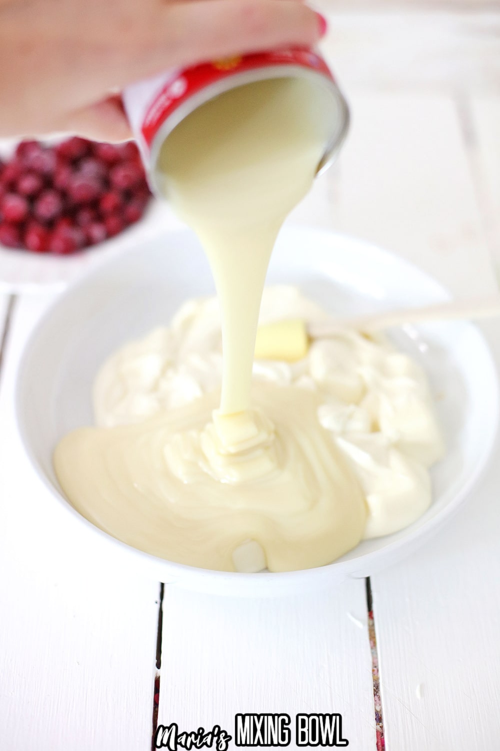 condened milk and white chocolate being mixed together