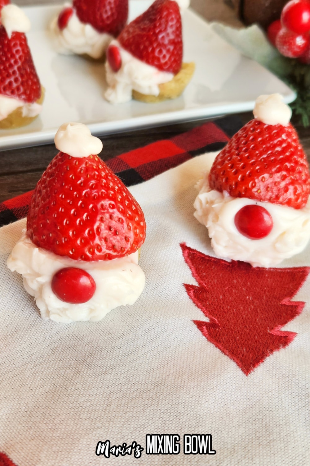 two snata gnome cookie cups on a christmas napkin