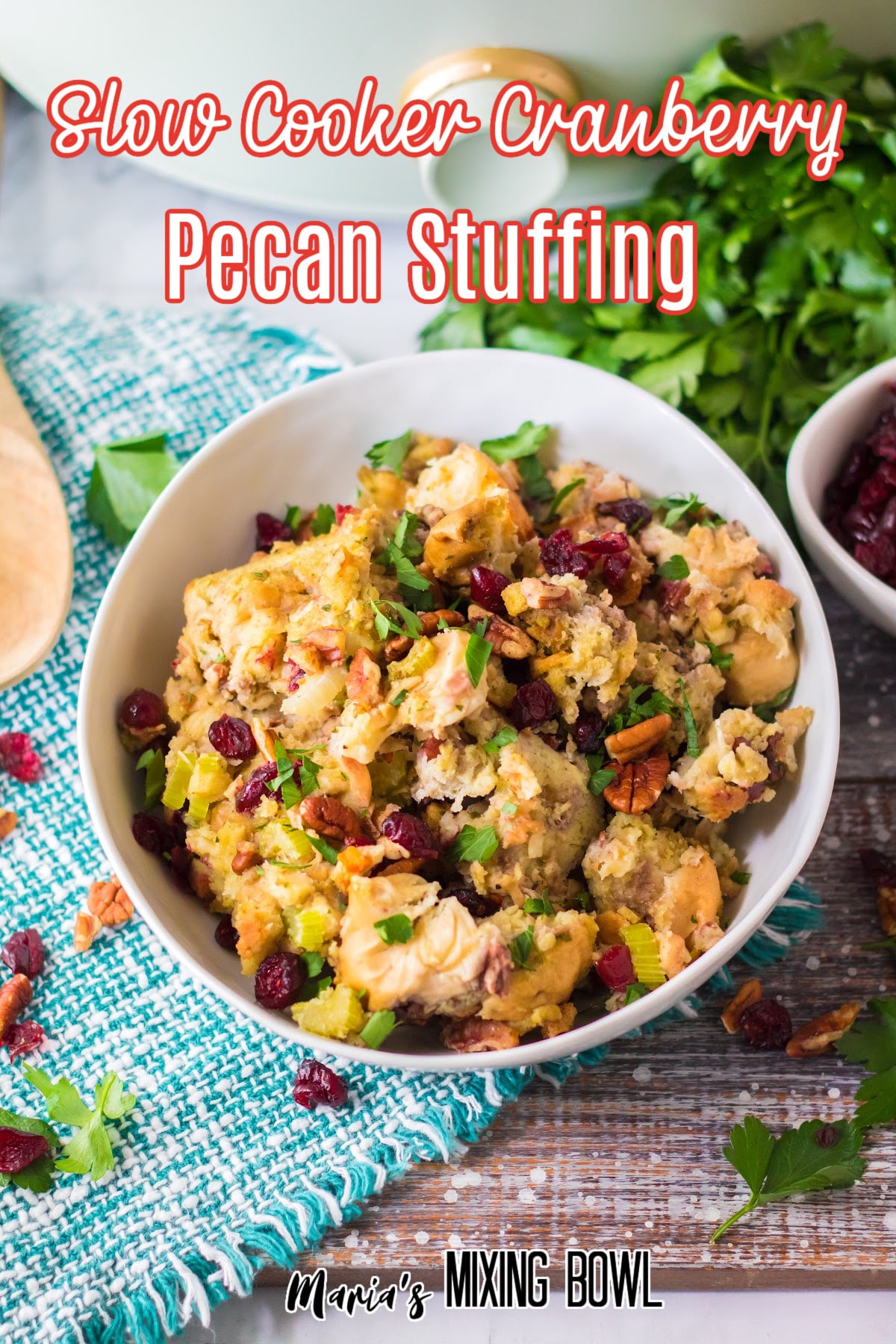 white bowl filled with slow cooker cranberry pecan stuffing