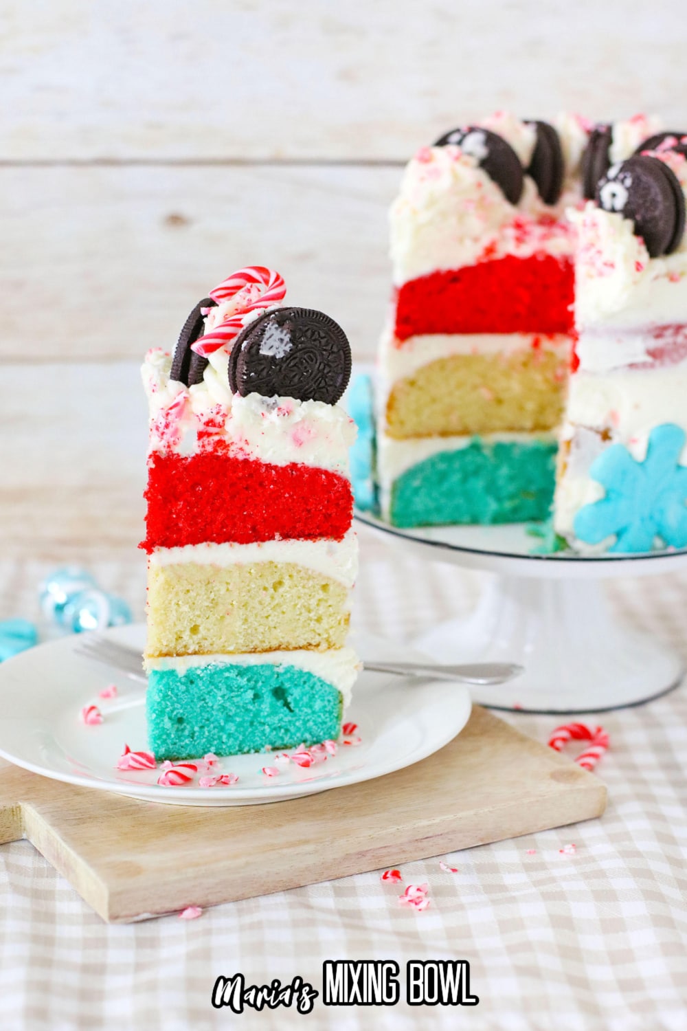 slice of white chocolate peppermint cake on a white plate