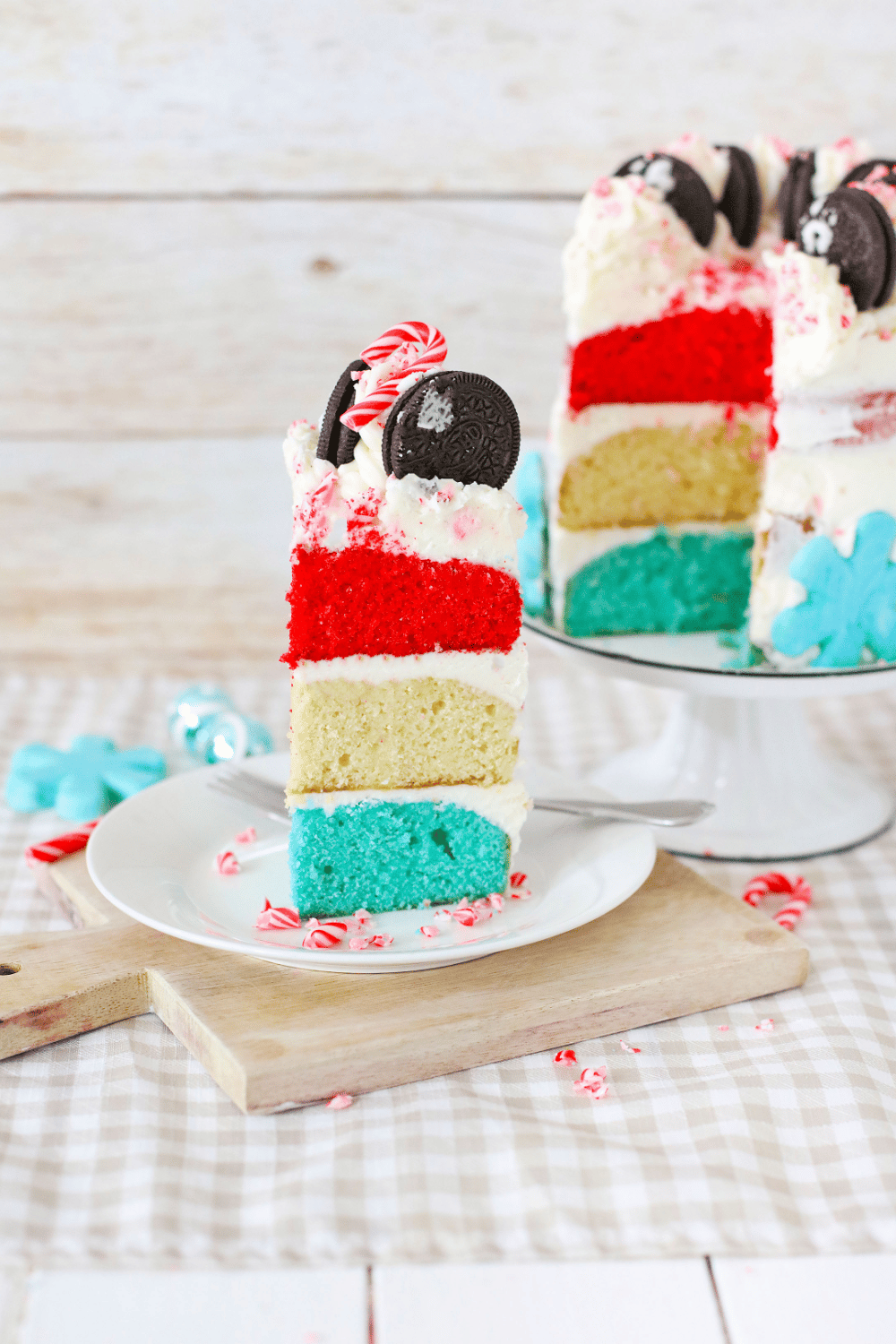 slice of white chocolate peppermint cake on a white plate
