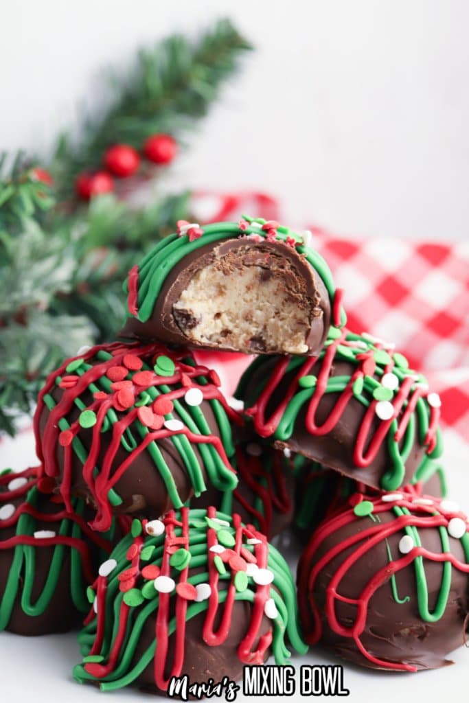 christmas no bake cookie dough bites stacked in a pyramid