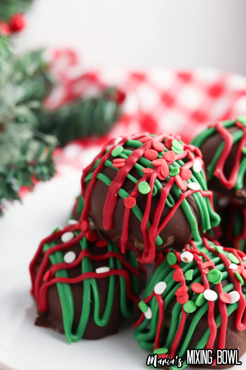 christmas no bake cookie dough bites stacked in a pyramid
