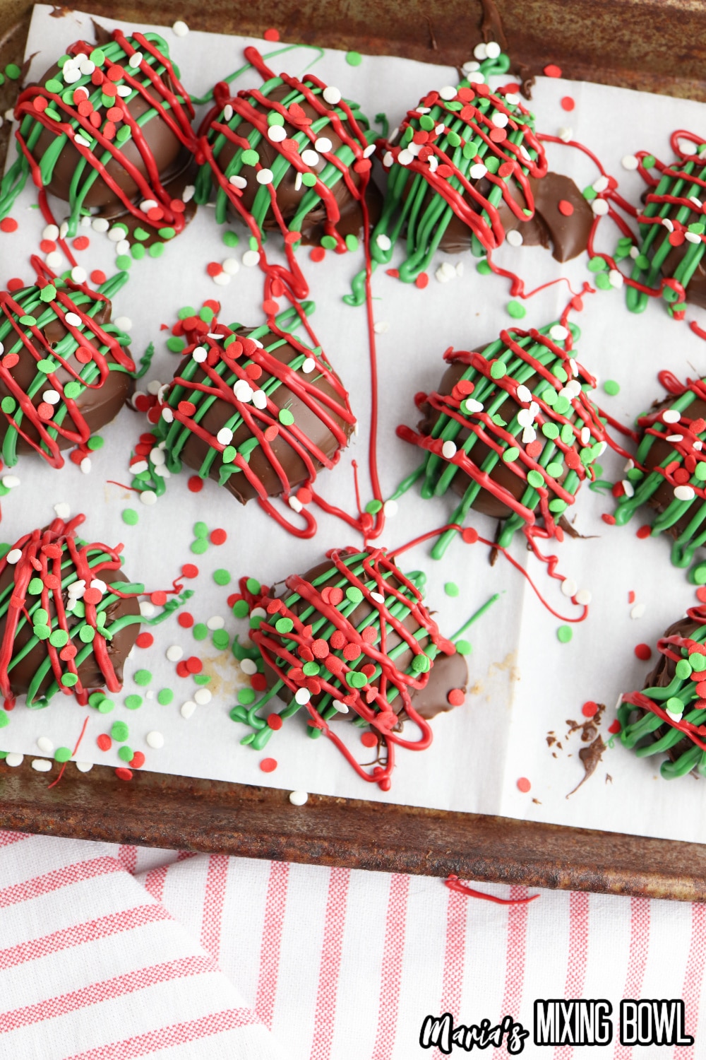 decorated cookie dough bites on a parchment lined baking sheet