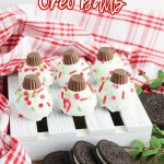 six christmas oreo balls on a white mini wooden pallet with the name in text for pinterest