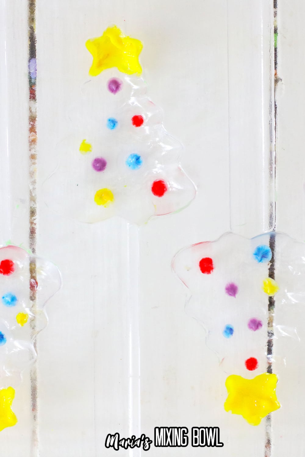 colored candy melts spread into a clear plasic mold