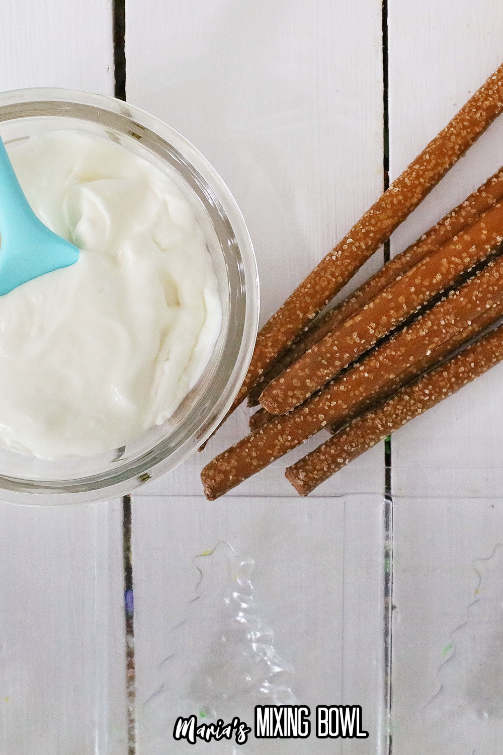 almond bark melted in a mason jar on a white wooden background