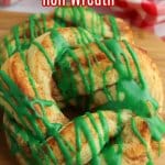 close up of a cinnamon roll wreath on a wooden cutting board with the name in text for pinterest