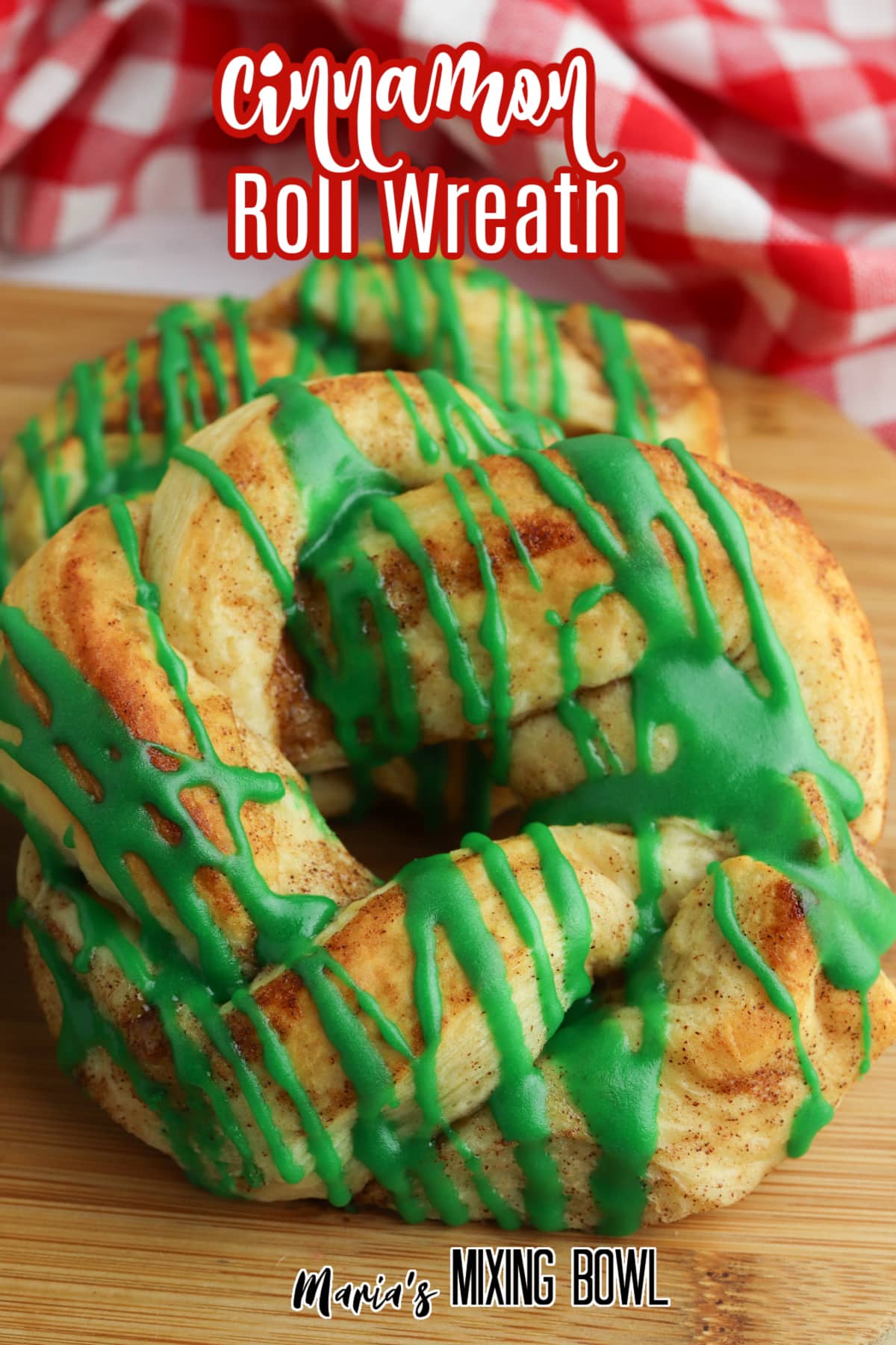 close up of a cinnamon roll wreath on a wooden cutting board with the name in text for pinterest
