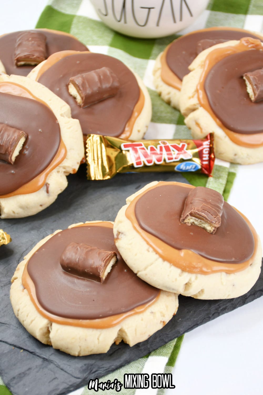 stack of twix cookies on a wooden board
