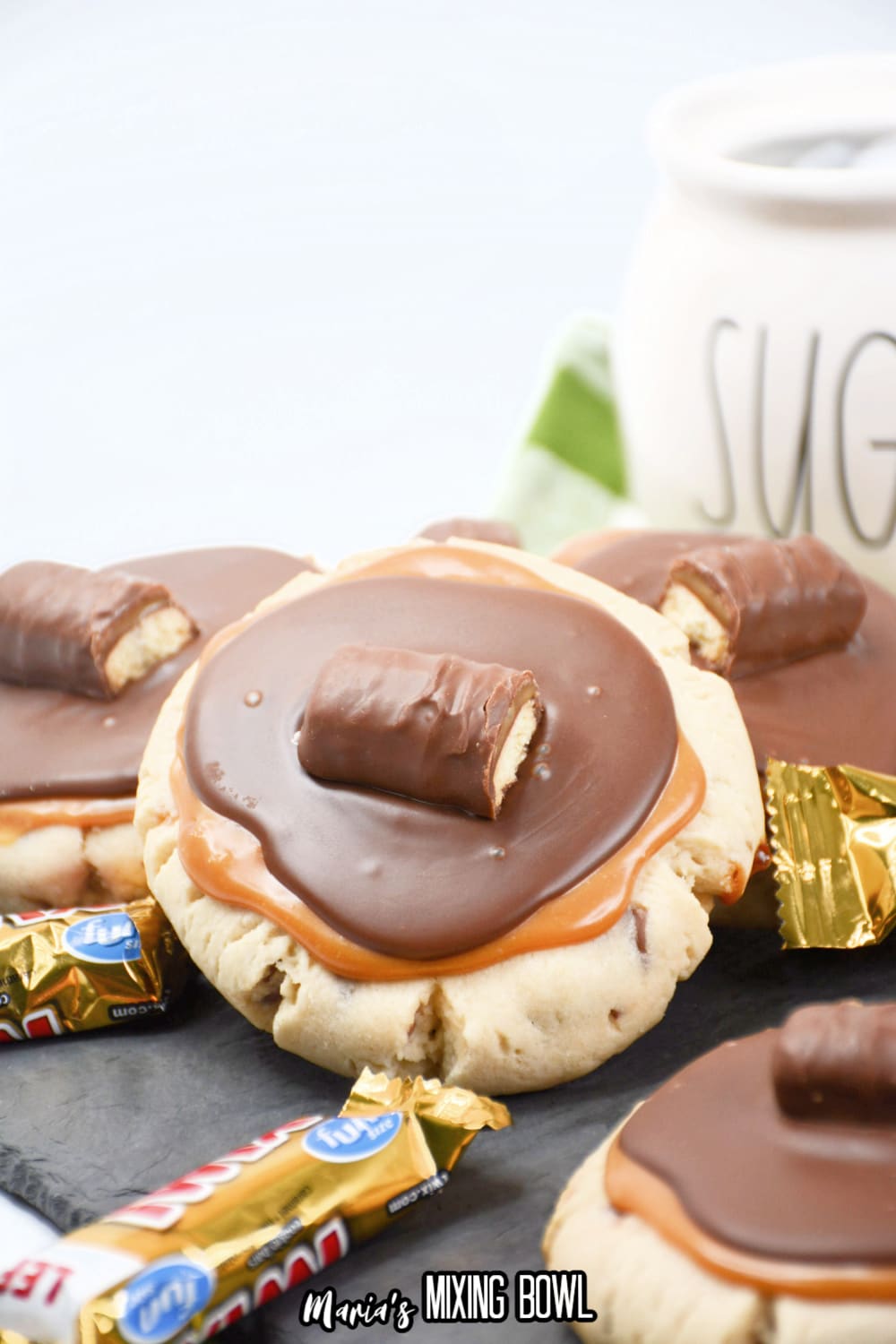 stack of twix cookies on a wooden board