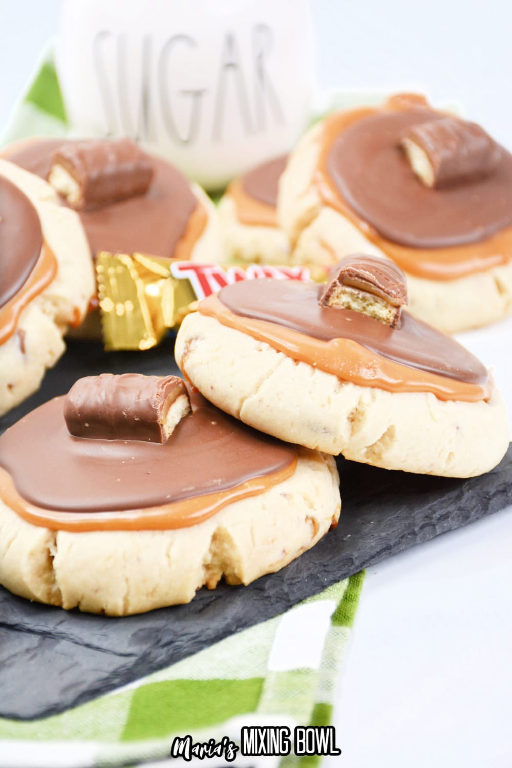 stack of twix cookies on a wooden board