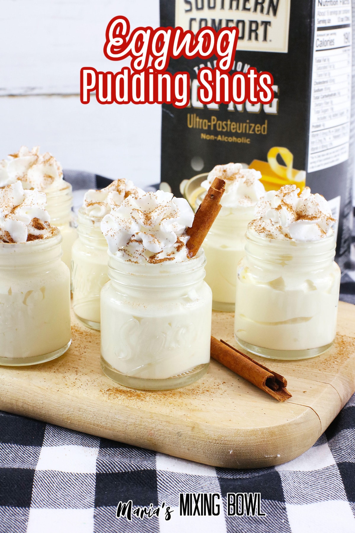 eggnog pudding shots on a wooden cutting board