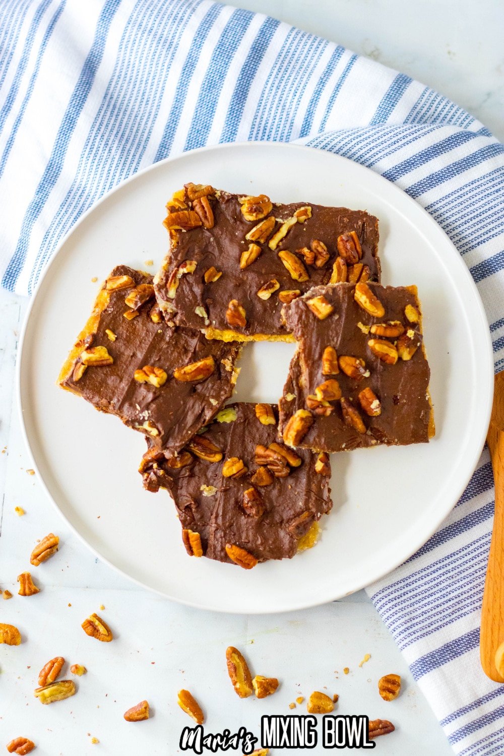 four pieces of graham cracker toffee bark on a white plate
