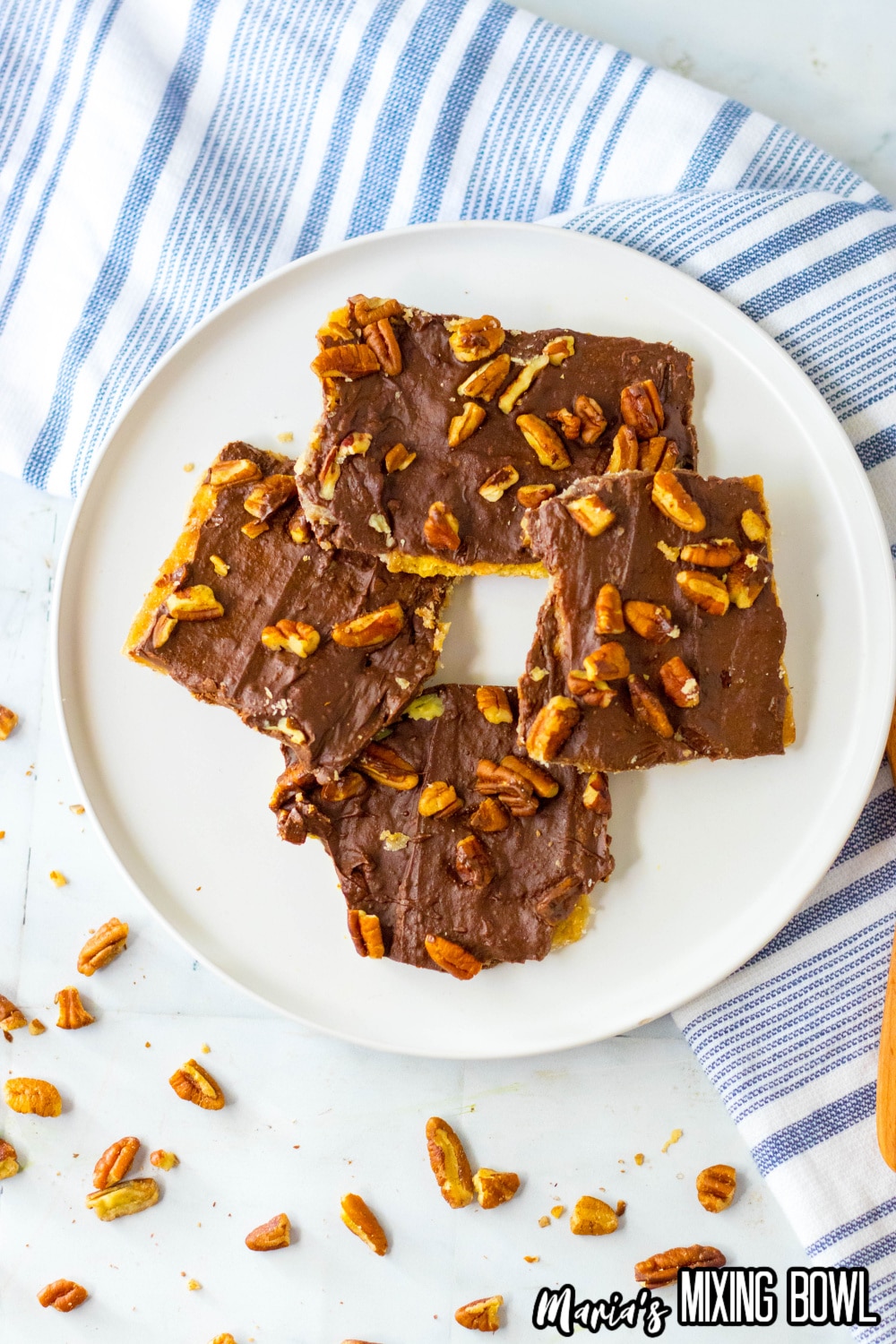 four pieces of graham cracker toffee bark on a white plate