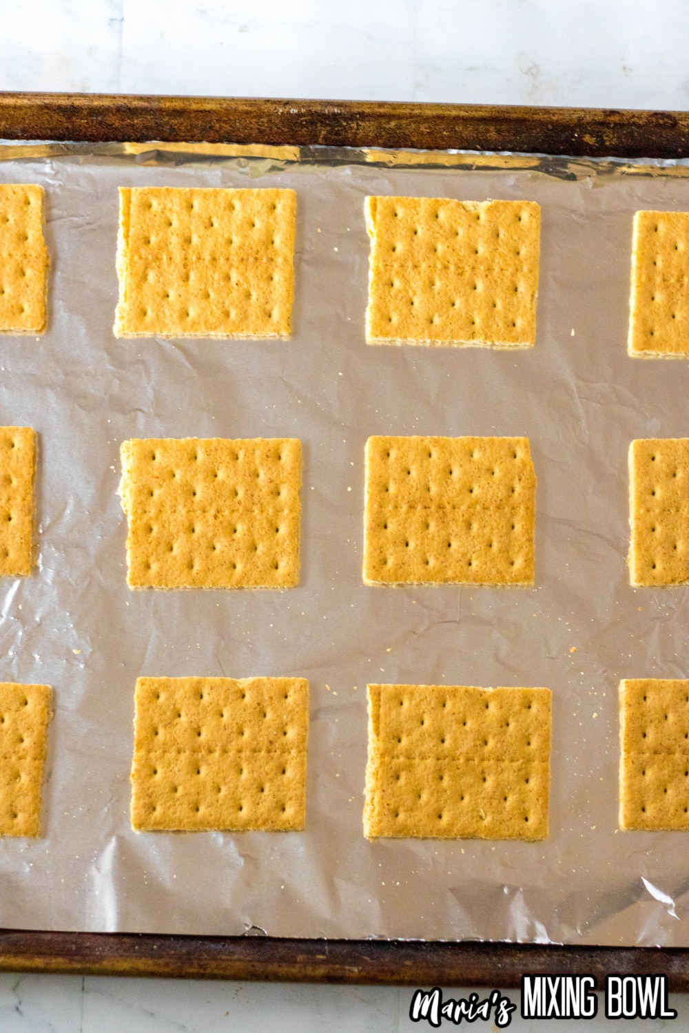 graham crackers on a foil lined baking sheet