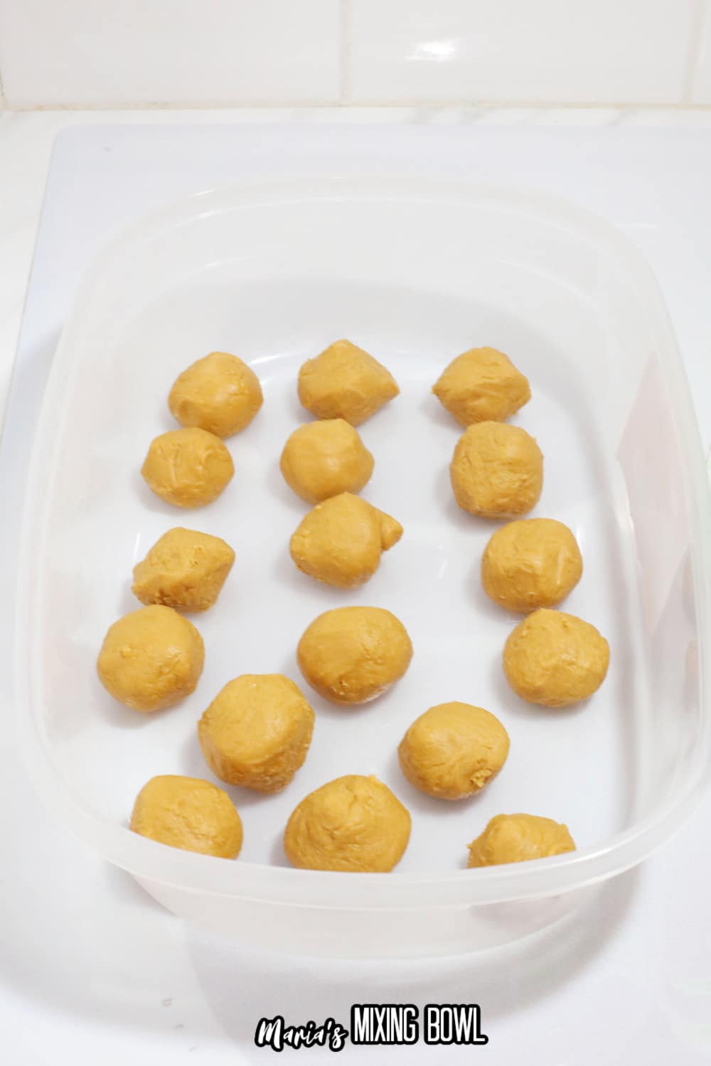 peanut butter balls in a rubbermaid storage container