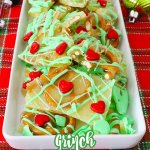grinch pretzel brittle on a white platter with the name in text for pinterest