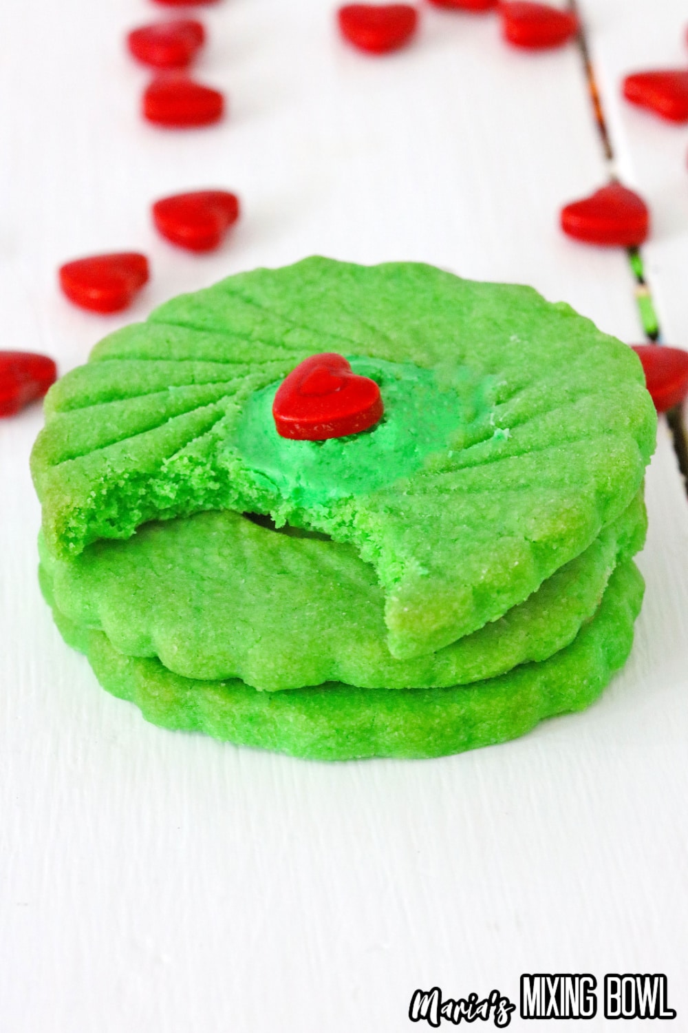 stack of three grinch thumbprint cookies