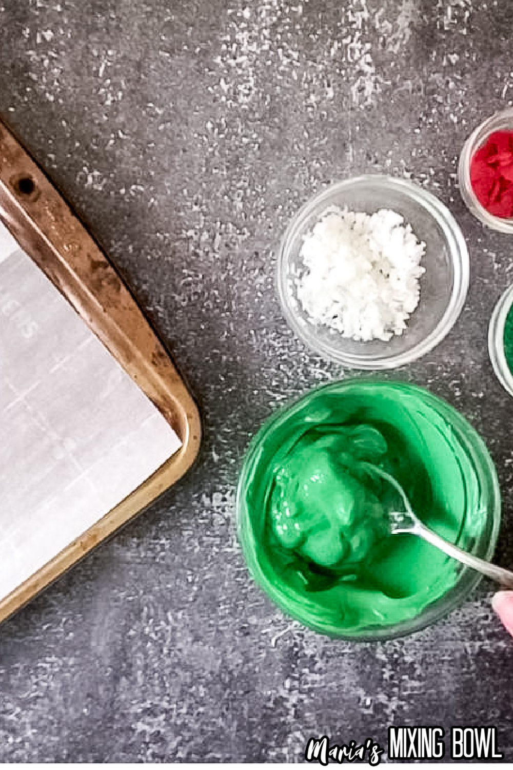 oreo and cream cheese balls being dipped in green candy melts