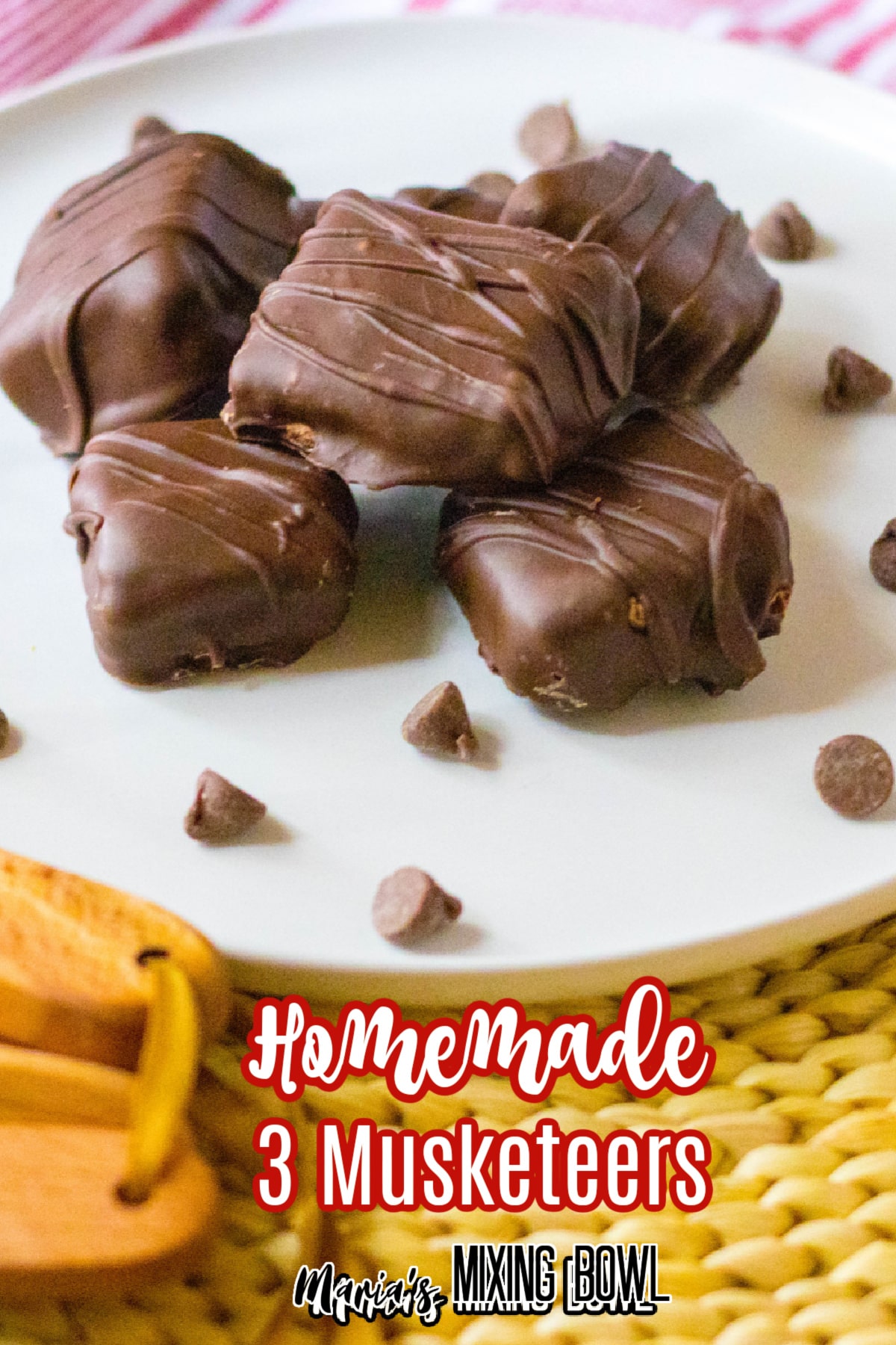 stack of homemade 3 musketeers on a white plate with the name in text for pinterest