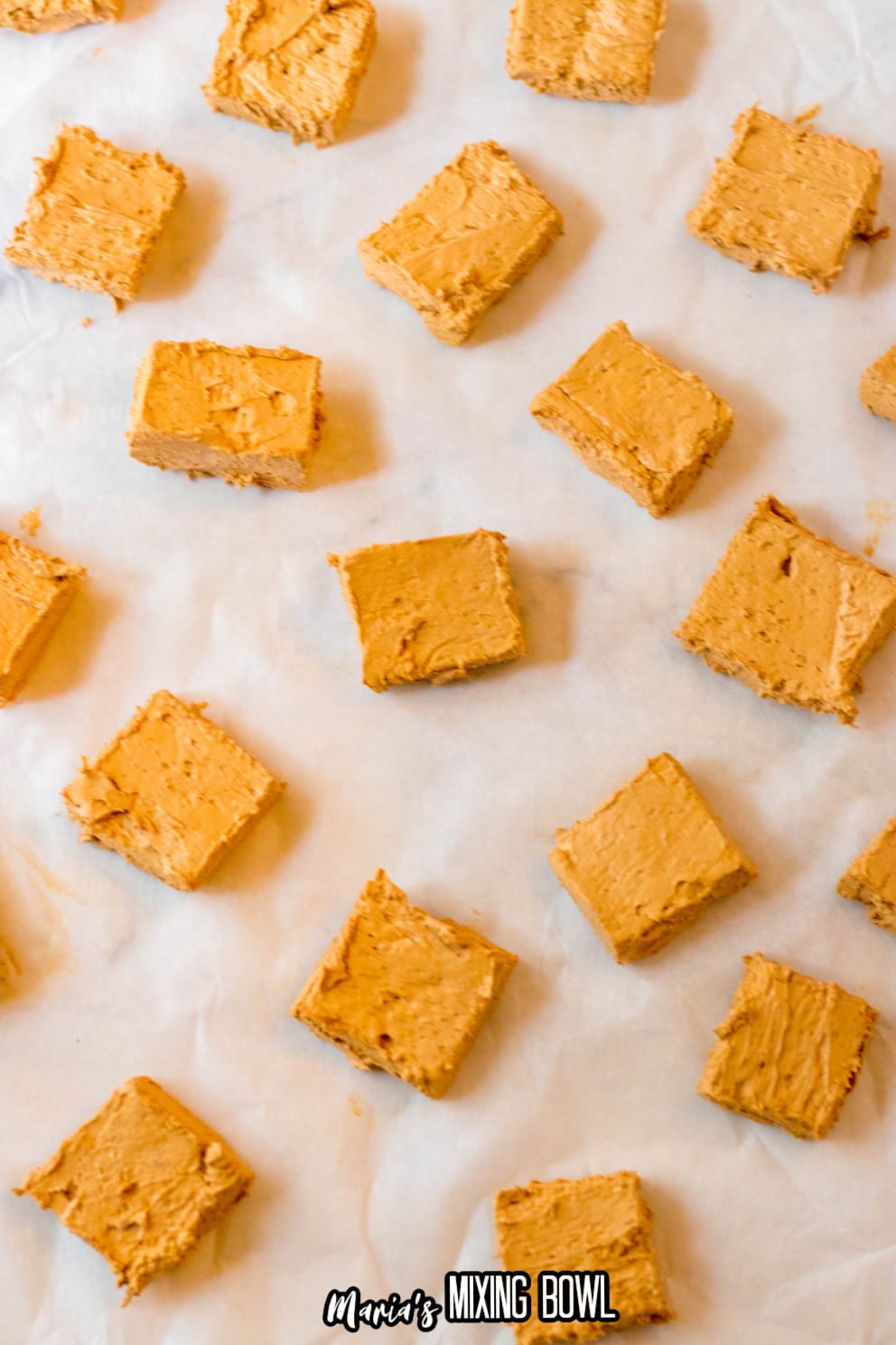 squares of homemade 3 muskteers on a parchment lined baking sheet
