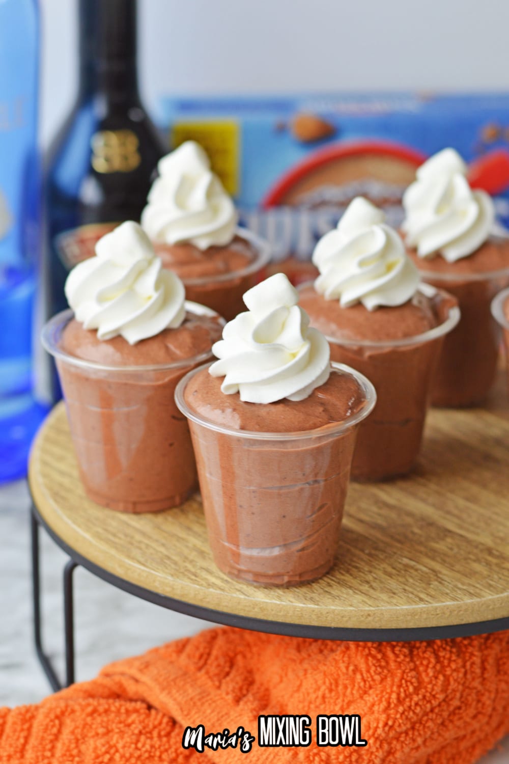 hot cocoa pudding shots on a wooden table