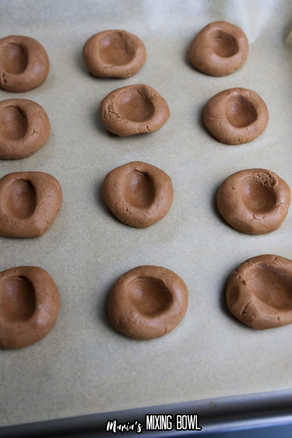 cookie dough on a parchment lined baking sheet