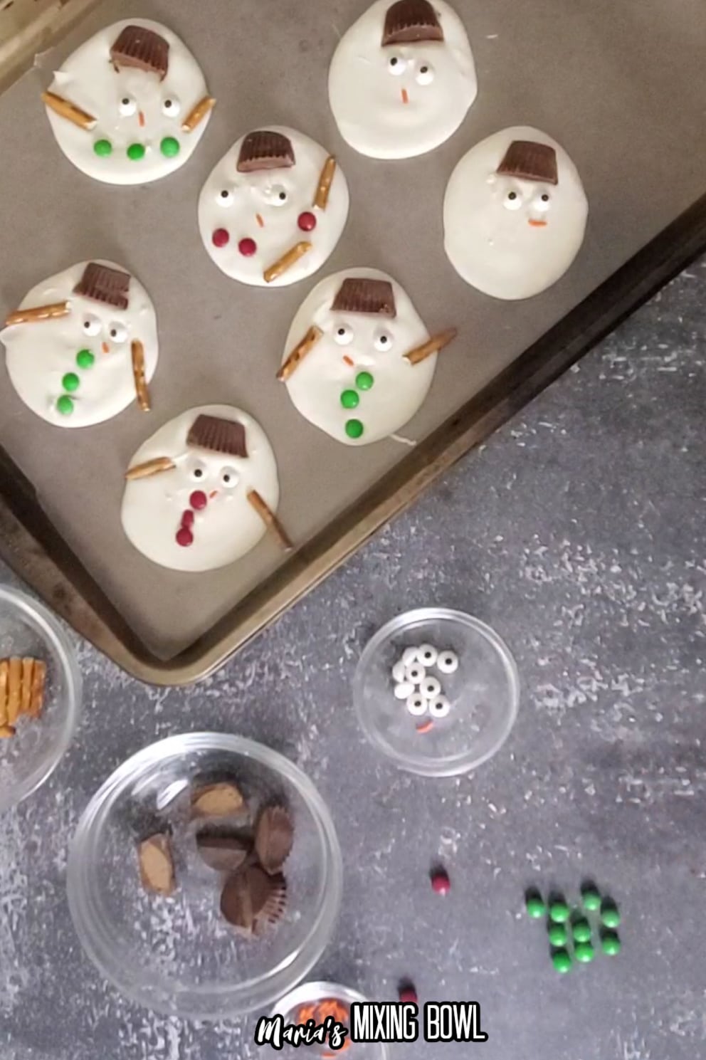 melted snowman bark being assembled on a baking sheet
