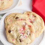 three peppermint chocolate chip cookies on a white plate