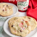three peppermint chocolate chips cookies on a white plate with the name in text for pinterest