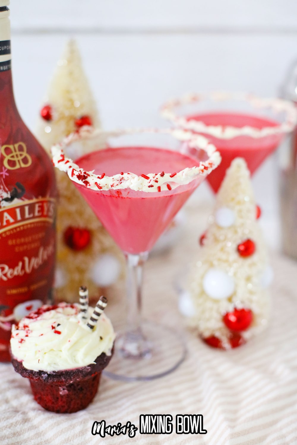 red velvet martini with a bottle of red vevlet baileys in the background