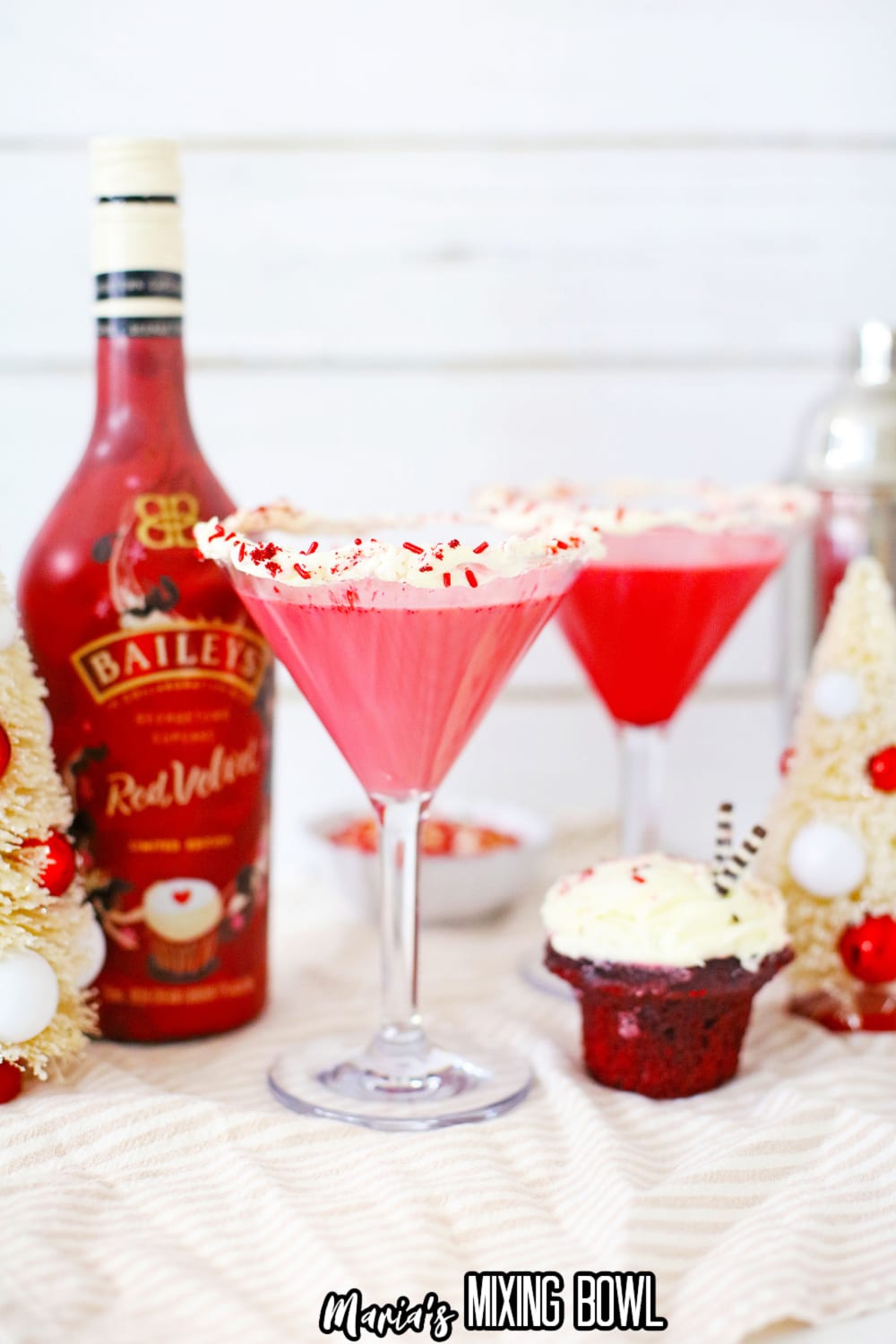 red velvet martini with a bottle of red vevlet baileys in the background