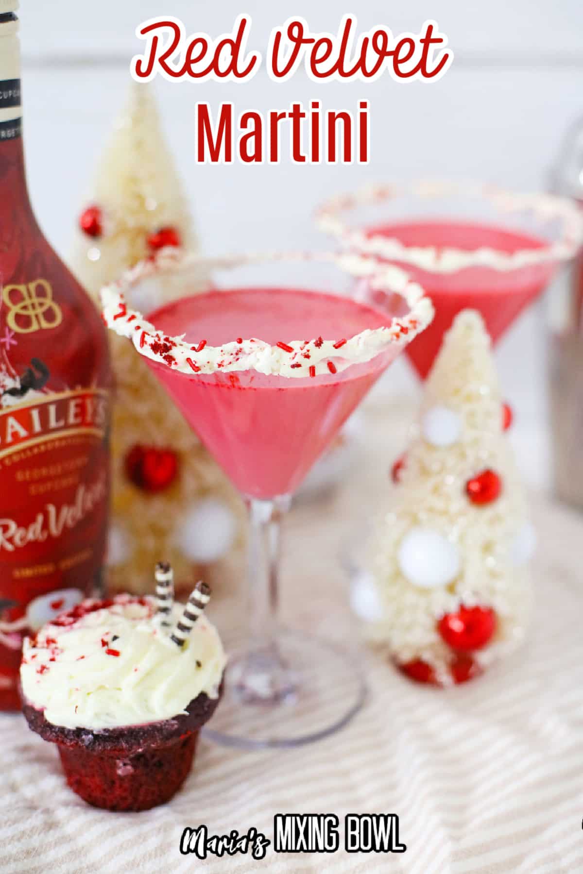 red velvet martini with a bottle of red vevlet baileys in the background