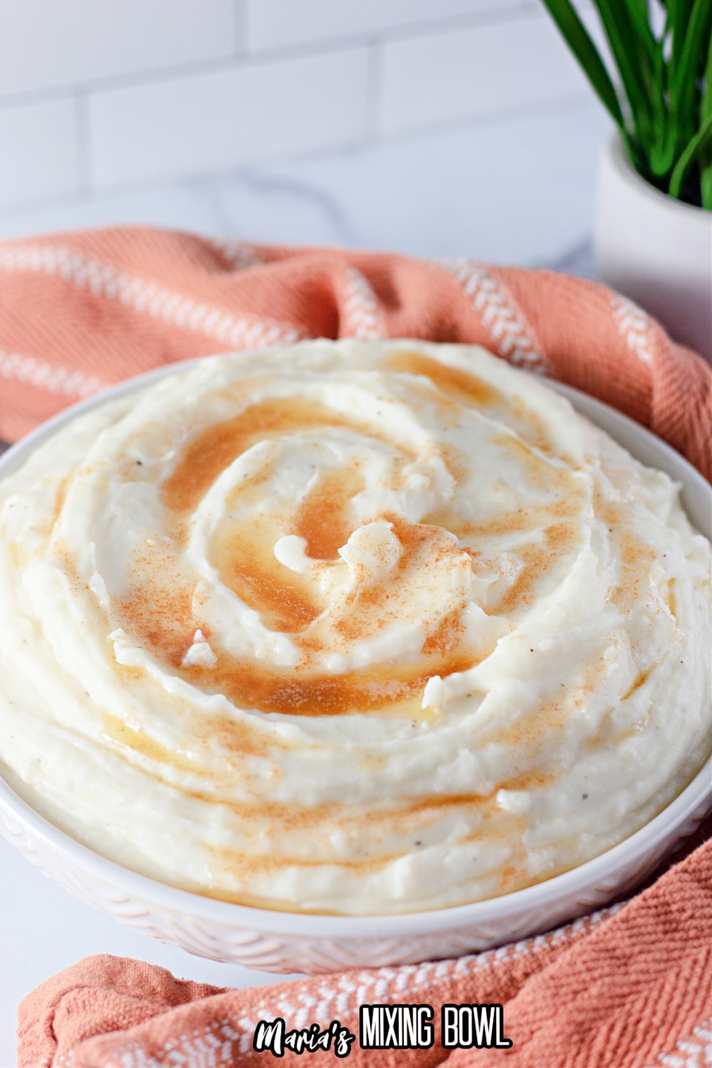 bowl of amish mashed potatoes topped with brown butter