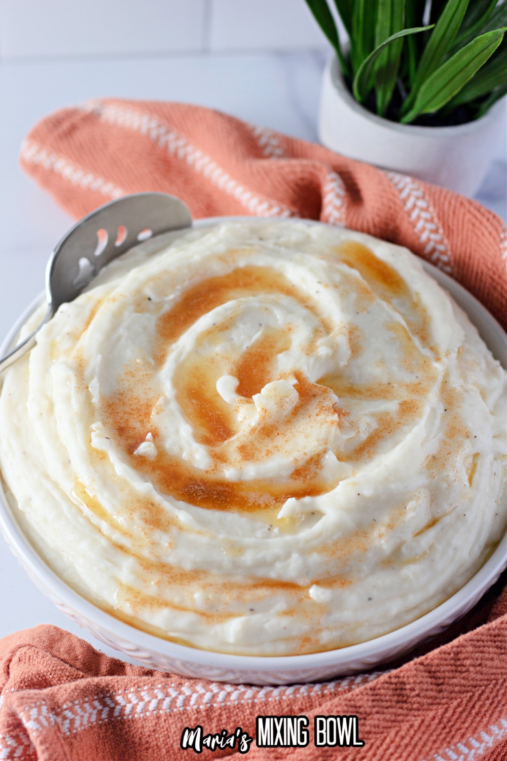 bowl of amish mashed potatoes topped with brown butter