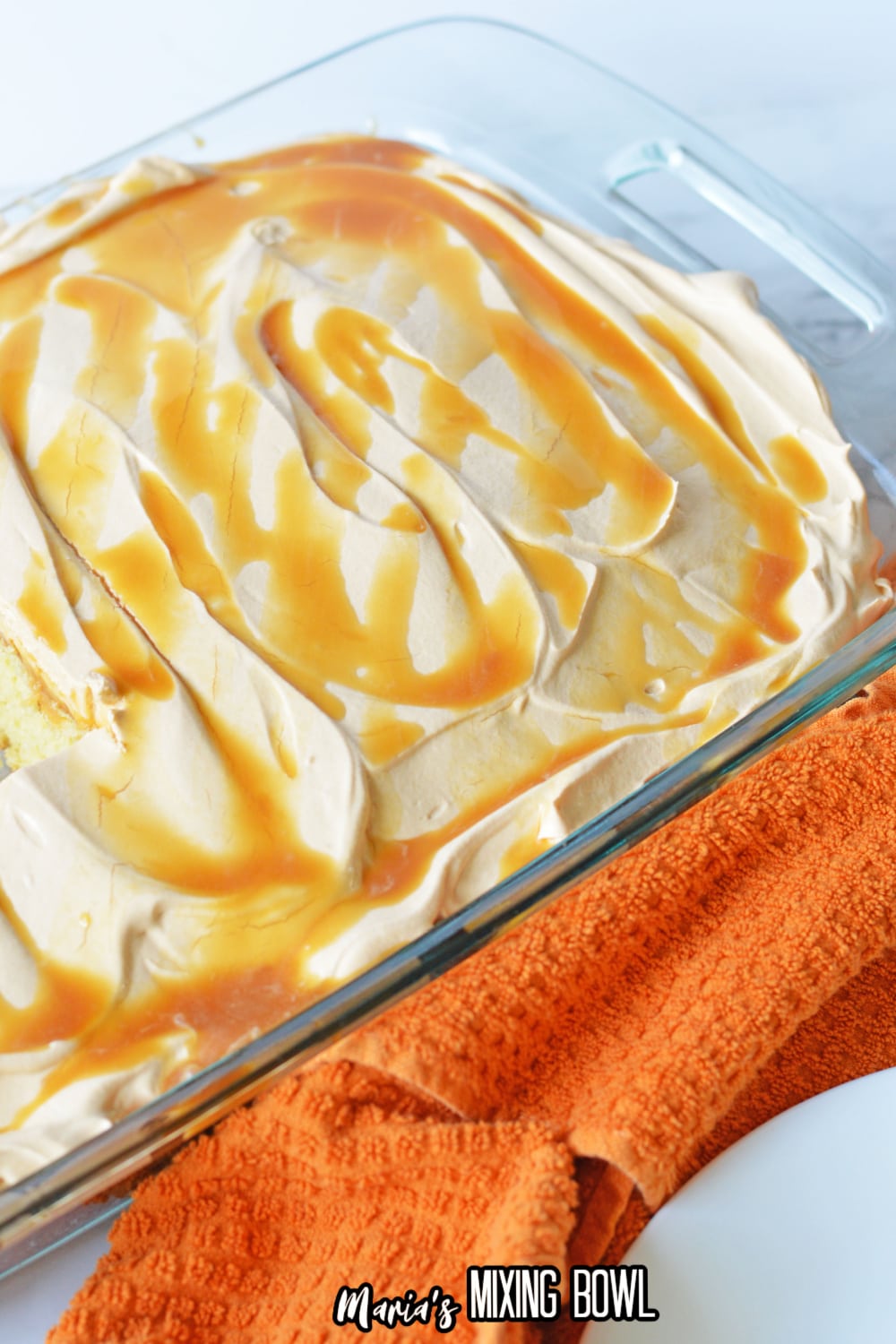 finished butterscotch poke cake in a glass baking dish